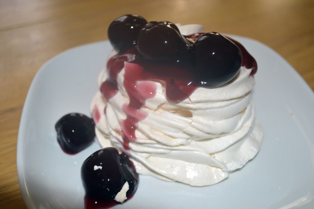 Meringue nest with  cherries and boozy cream